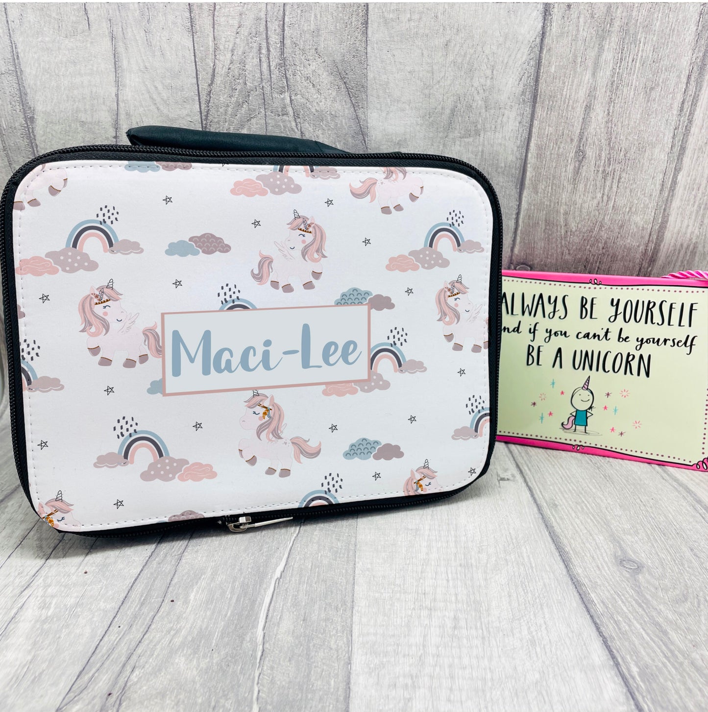 Unicorns everywhere! This lunch bag is printed with a pattern of unicorns and rainbows with a name in the middle. The bag is fully insulated with a carry handle a zip closure