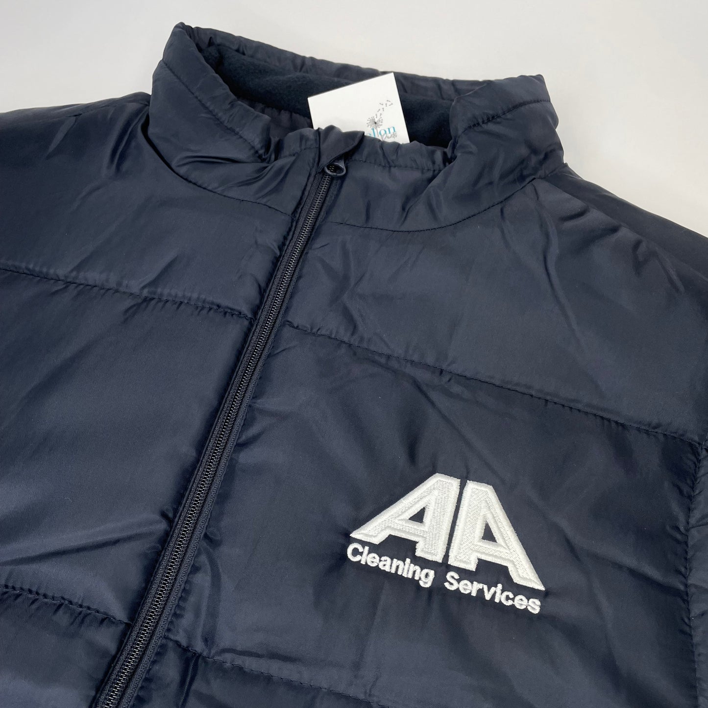 This is a waterproof padded bodywarmer gilet. The gilet is either blue or black and has a business logo embroidered on the front