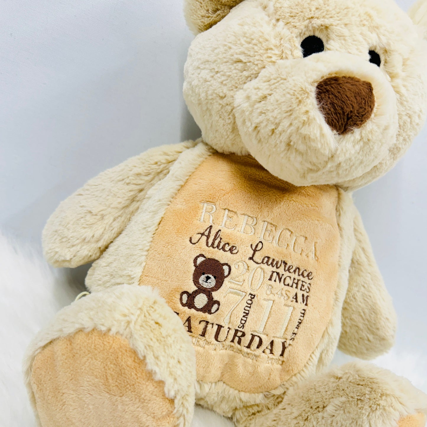 This is a gorgeous brown teddy bear. The bears belly is embroidered with a new babies birth details - date, name, weight etc. This is a lovely nursery accessory and a keepsake to cherish for years