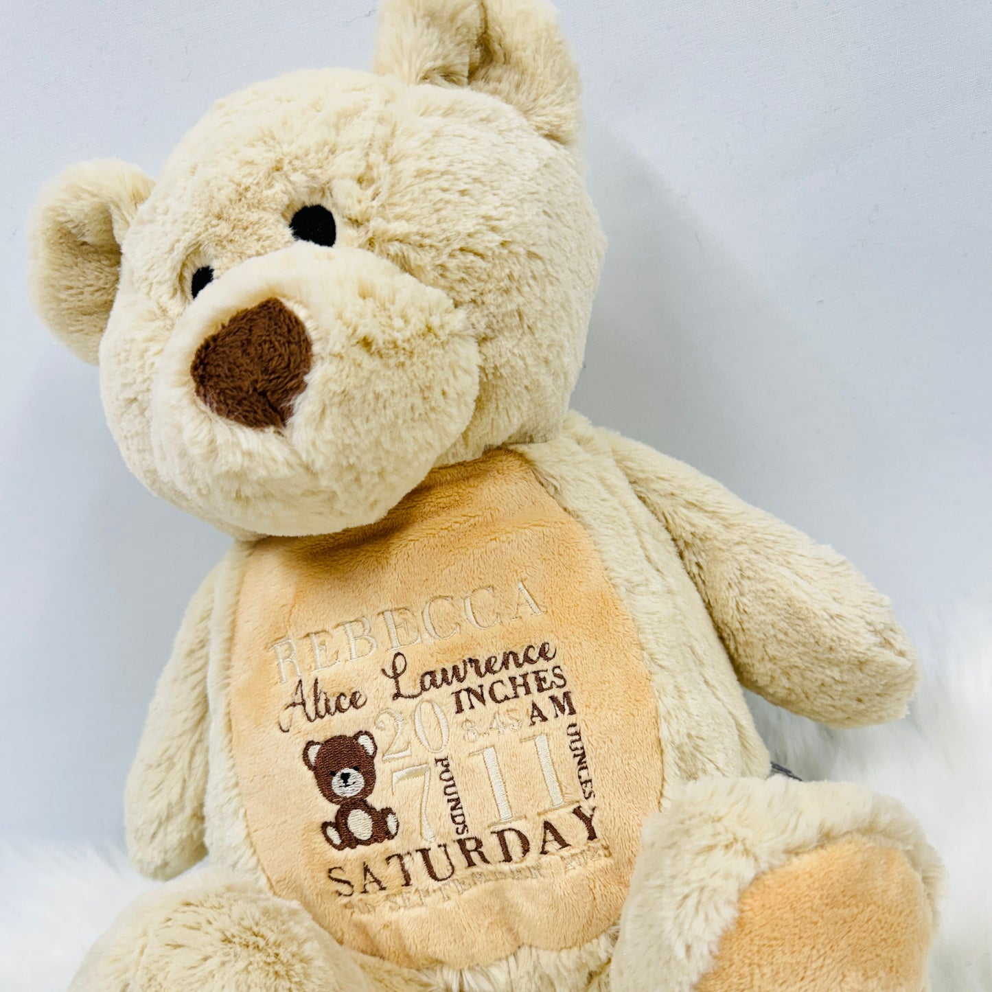 This is a gorgeous brown teddy bear. The bears belly is embroidered with a new babies birth details - date, name, weight etc. This is a lovely nursery accessory and a keepsake to cherish for years