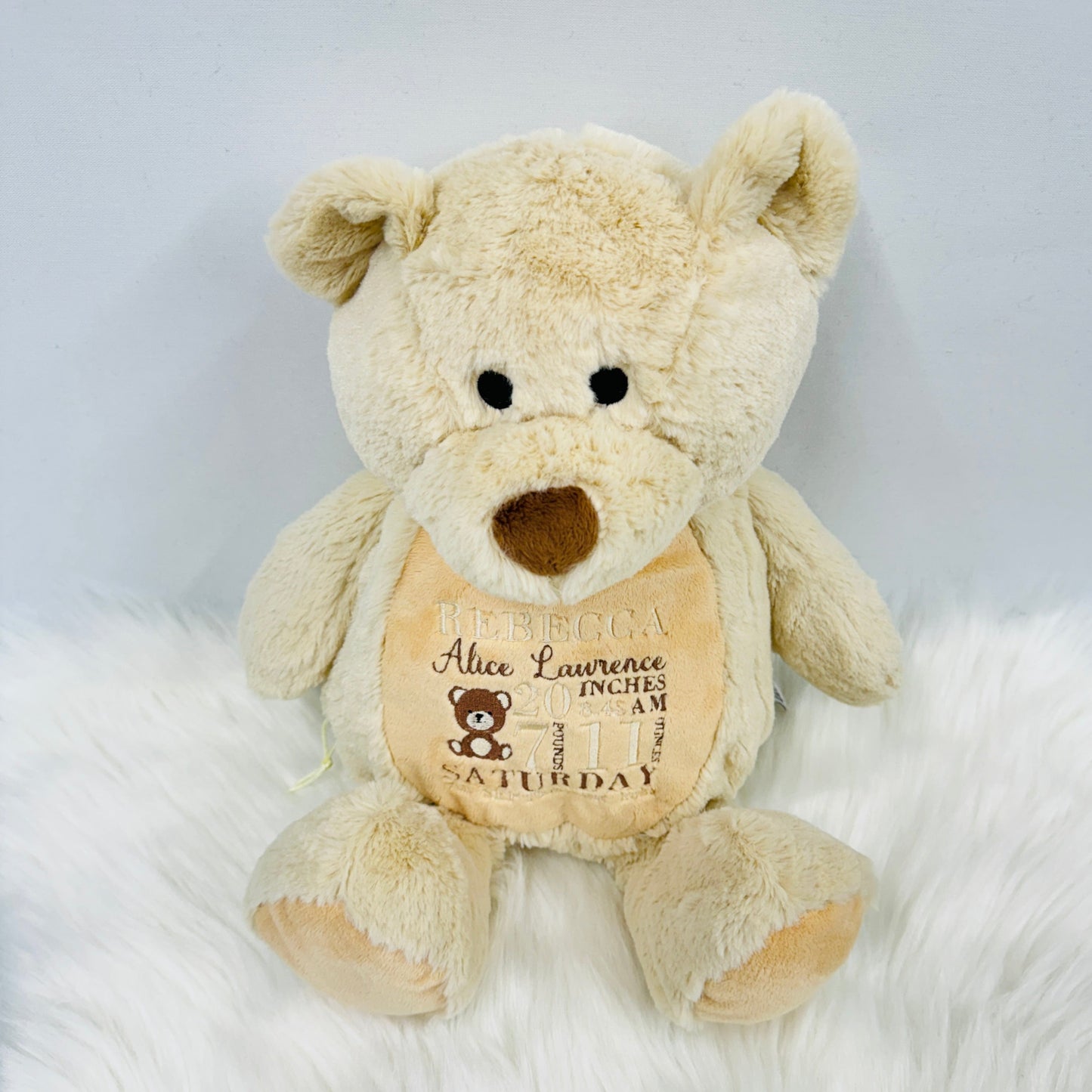 This is a gorgeous brown teddy bear. The bears belly is embroidered with a new babies birth details - date, name, weight etc. This is a lovely nursery accessory and a keepsake to cherish for years