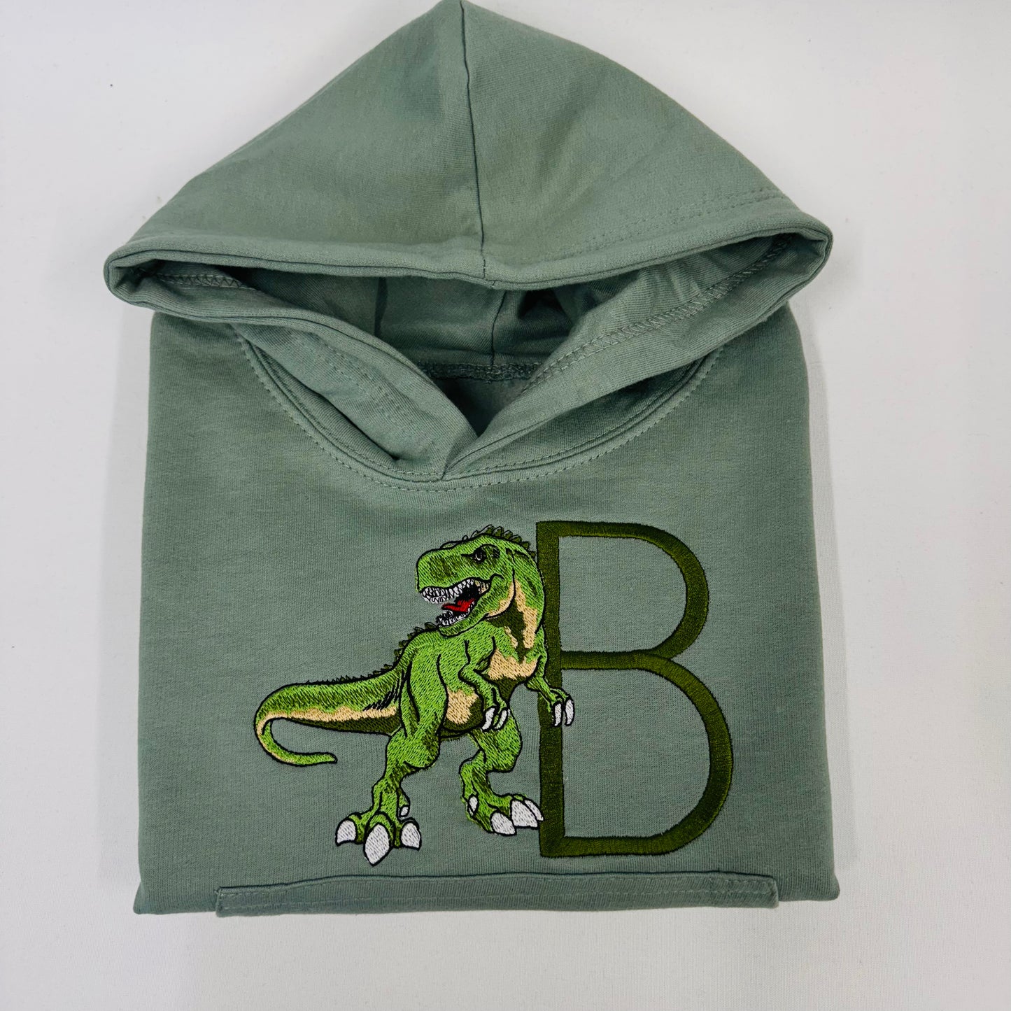 Adorable Sage Kids Hoodie with T-Rex Dinosaur and Embroidered Initial Detail