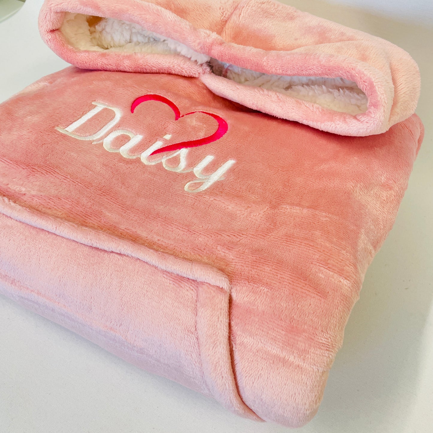 This is a super oversized fleece and sherpa hoodie for children. This is personalised with a name and a heart. Available in two different sizes. Snuggle up nice and warm in a personalised, oversized hoodie.