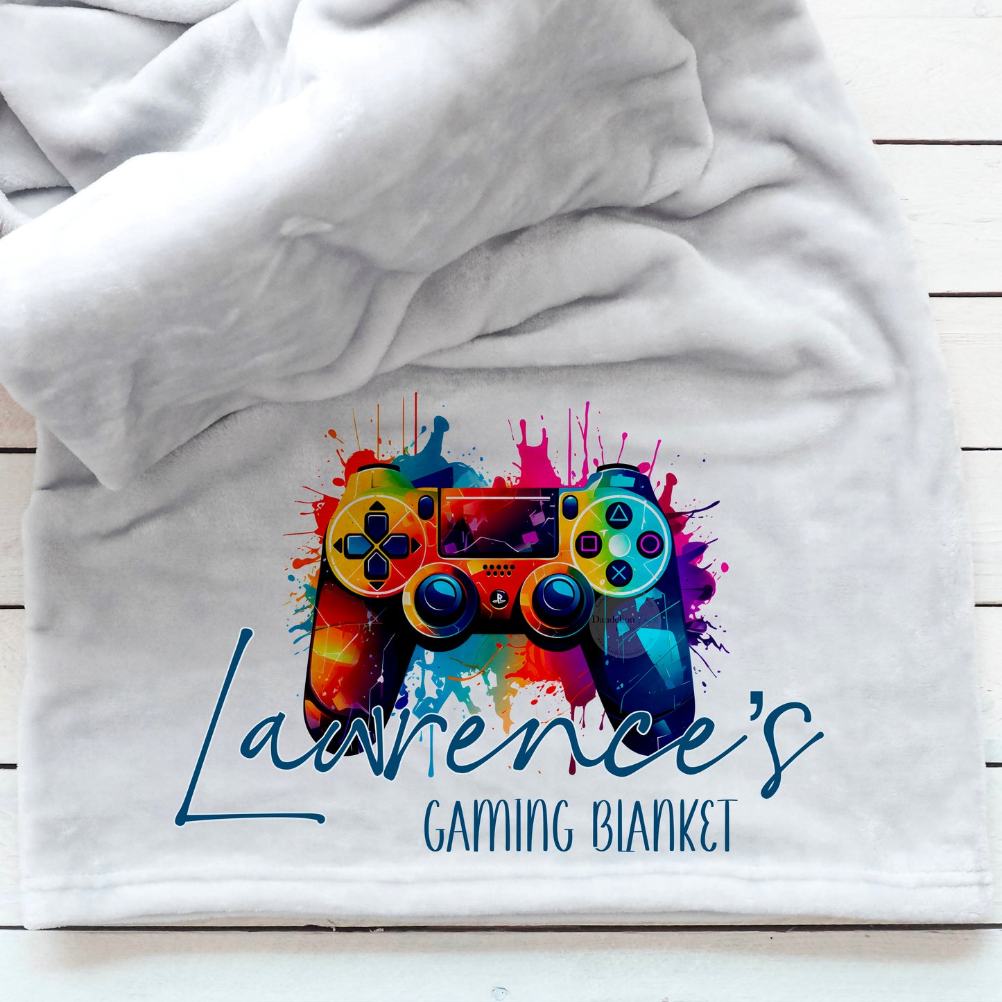 This is a gaming blanket personalised with a name. The blanket has a bright and colourful playstation controller printed behind the name.