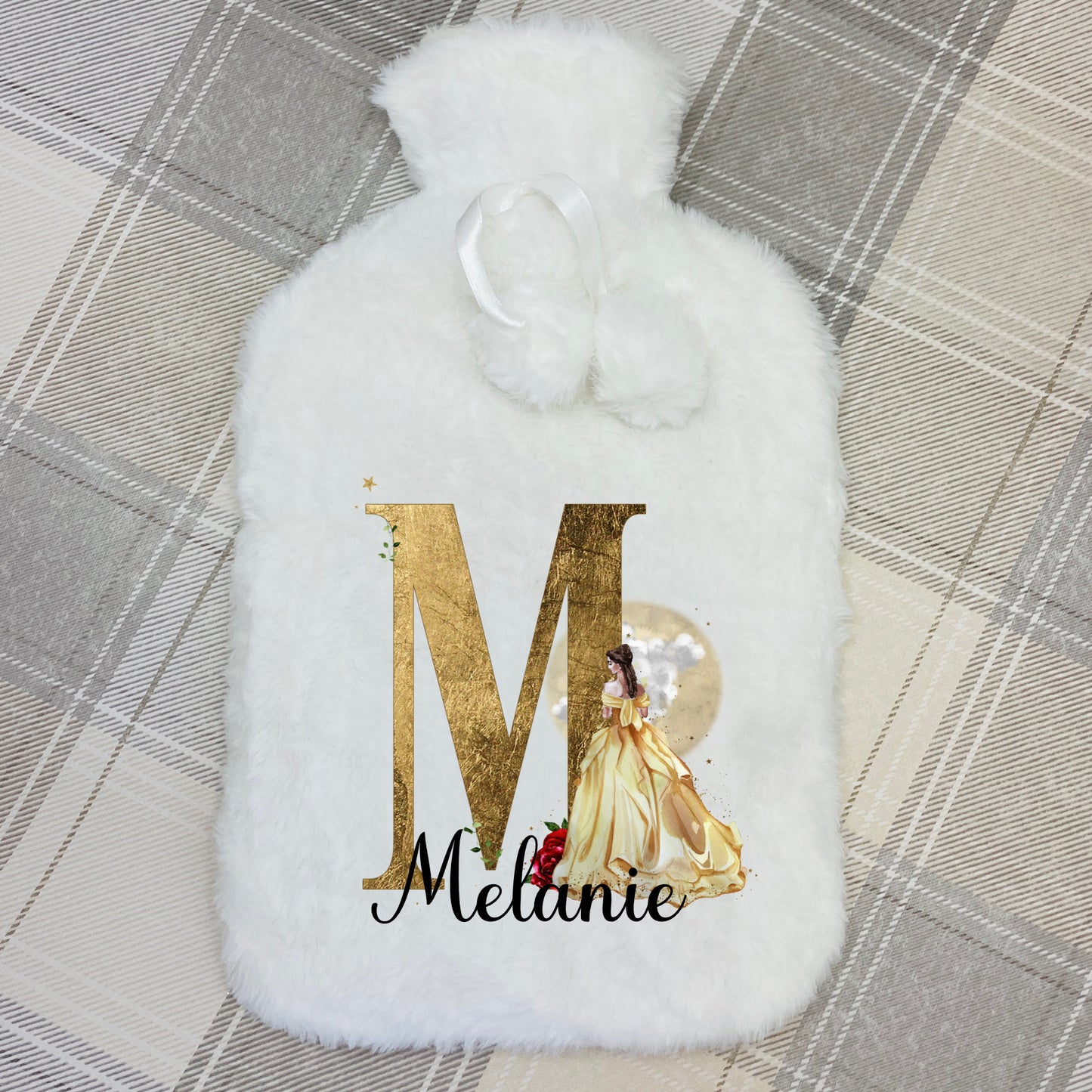 This is a super fluffy white 2 litre hot water bottle and cover. The cover is personalised on the front with a name printed in front of a beautiful golden princess with a gold initial too. This is a perfect gift for any girl.