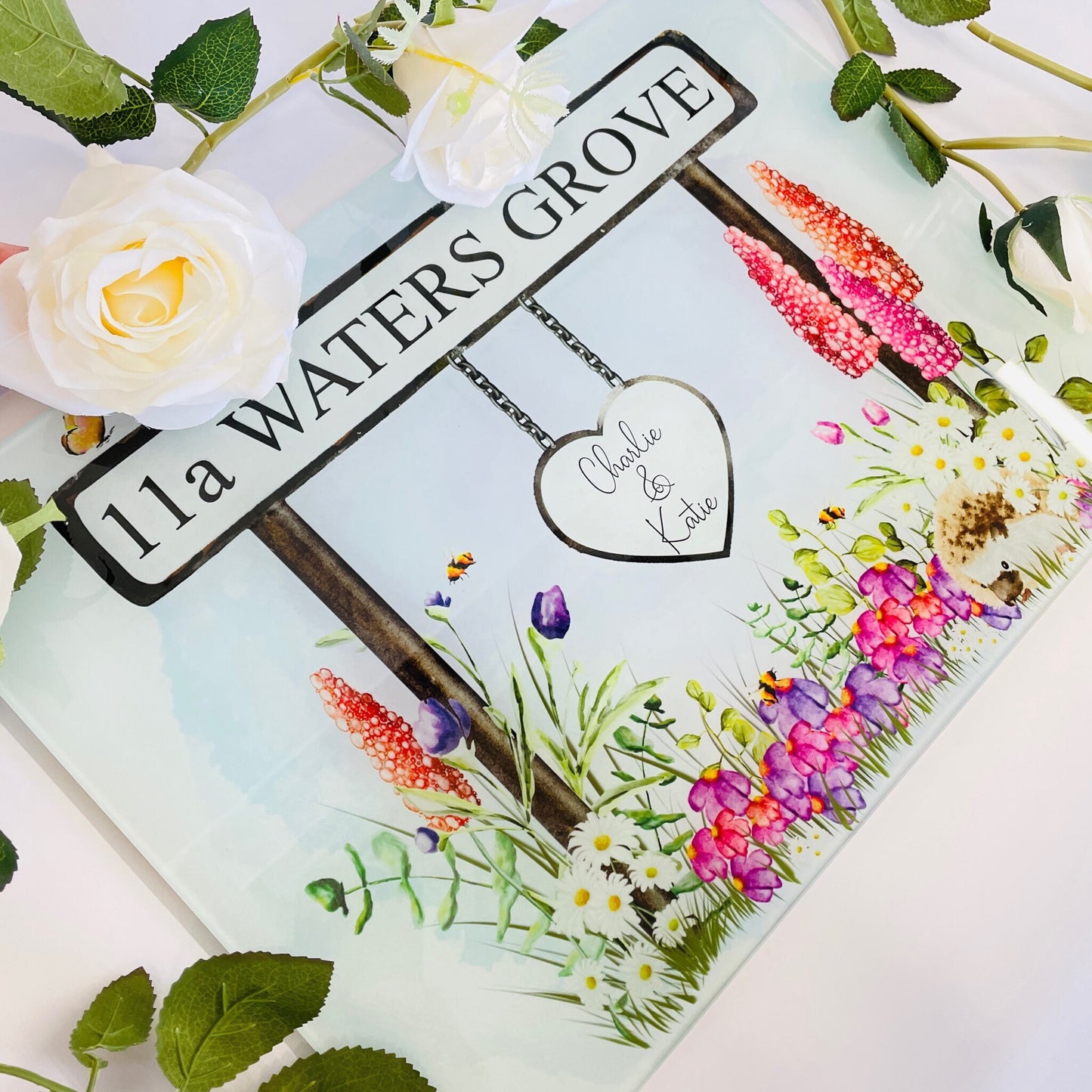 New home glass chopping board printed with a beautiful floral street sign. Customers can have the street sign with the new address. Also has a hanging sign for recipients names