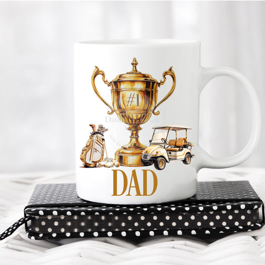 This is a white 11oz mug printed with a number 1 trophy, bag and golf buggy. A name is printed below the gold and cream design.