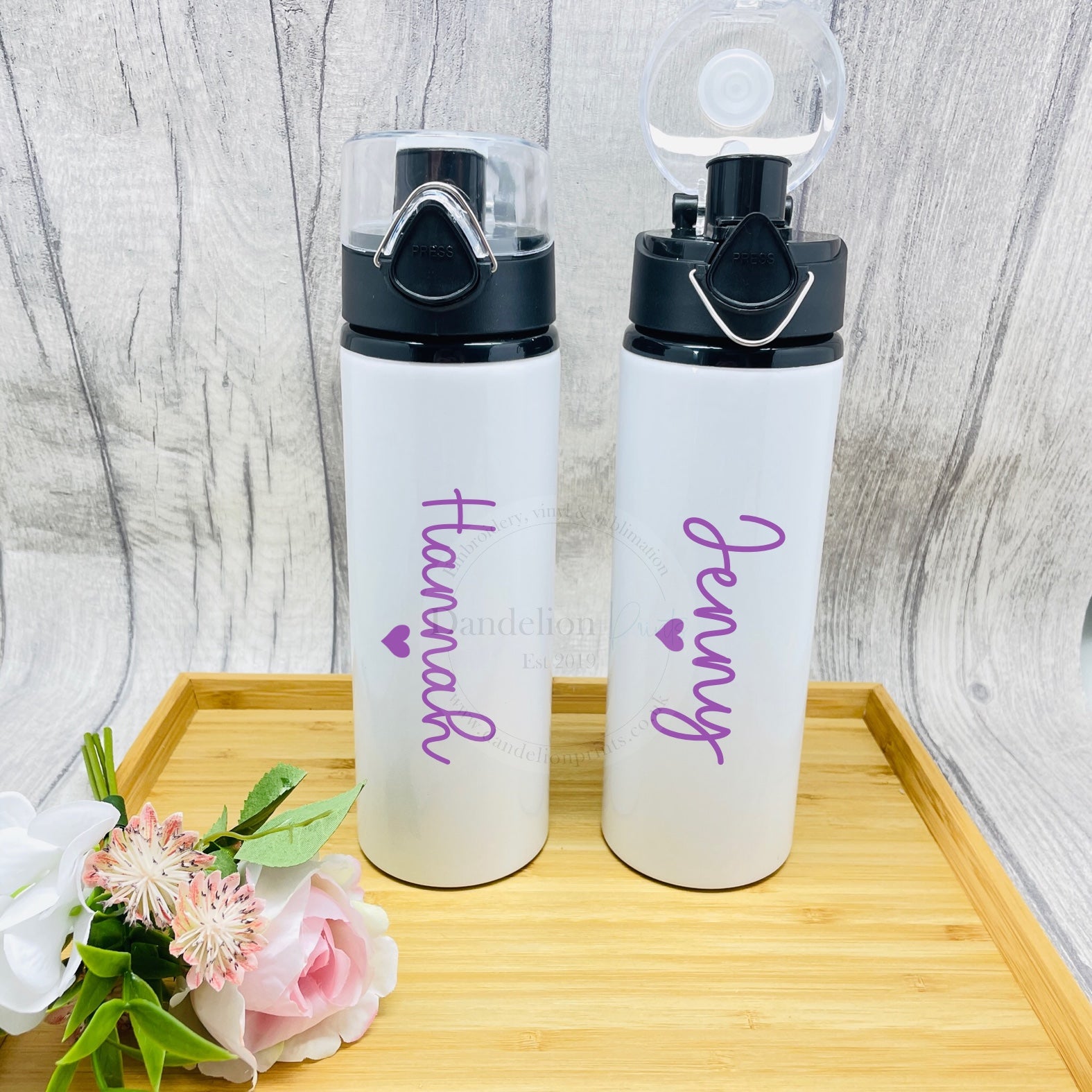 This is a great water bottle to use at the gym or any sporting activity. Made from aluminium, they are durable. They have a lock and button to open the lid. Printed with your name and a heart in the colour of your choice