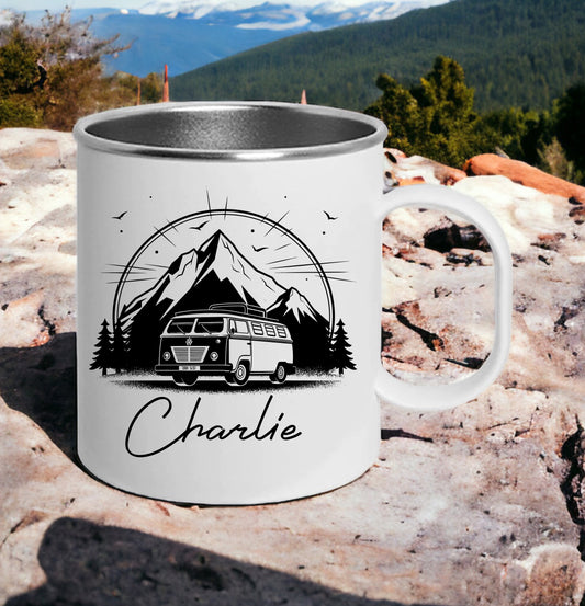 his is a white and silver unbreakable mug. Printed on the mug is a campervan with mountains and trees behind it. Below the image a name is printed. Personalised, unbreakable camping or caravan gift idea