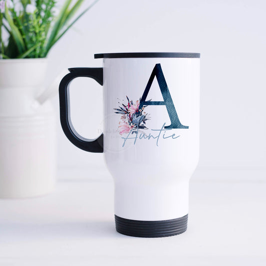 This is a white travel mug made from stainless steel with a handle and lid. Printed on both sides of the travel mug is a blue textured initial and pink flowers. Personalised with a name this is a great gift for people on the go.