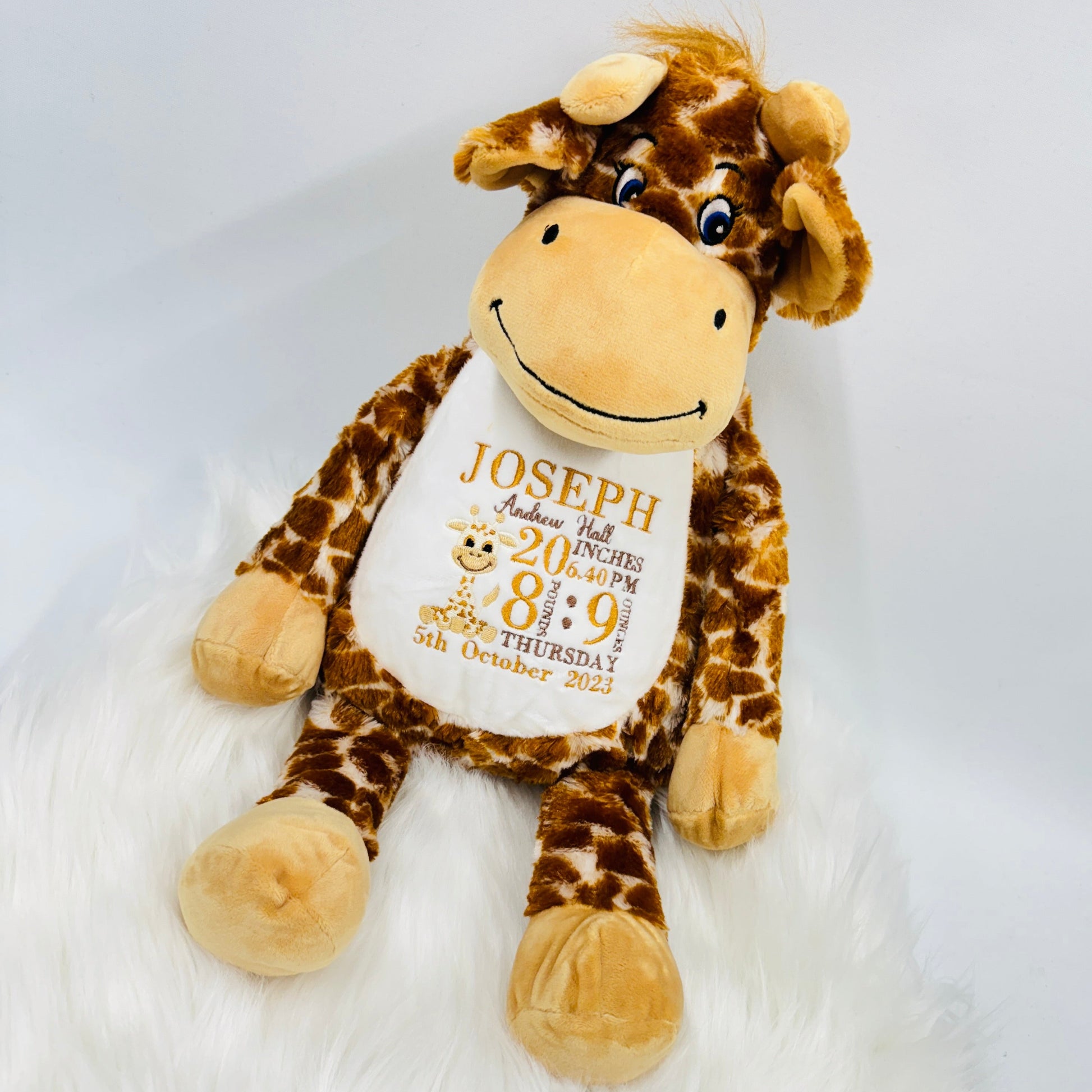 This is a giraffe keepsake teddy. Beautifully embroidered on its belly are a babies birth stat details. The teddy has a zip access at the back for easy washing. Details on the belly are birth weight, time, date, name, length and a mini giraffe too