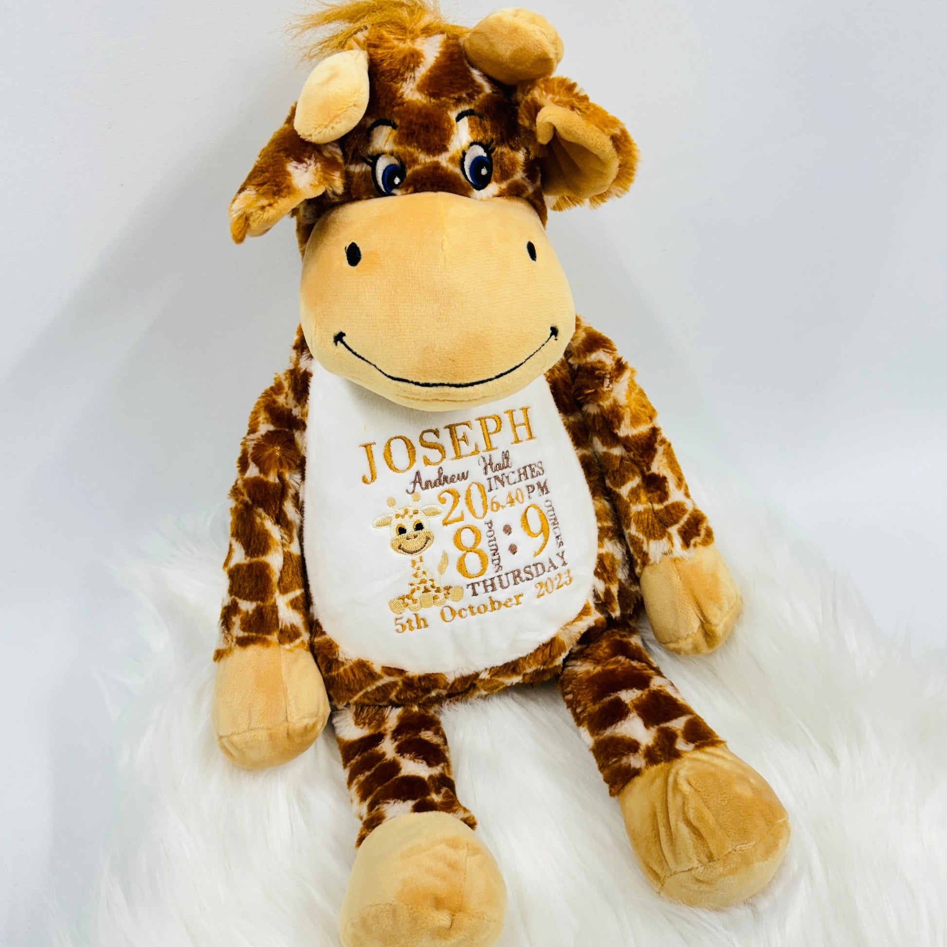 This is a giraffe keepsake teddy. Beautifully embroidered on its belly are a babies birth stat details. The teddy has a zip access at the back for easy washing. Details on the belly are birth weight, time, date, name, length and a mini giraffe too