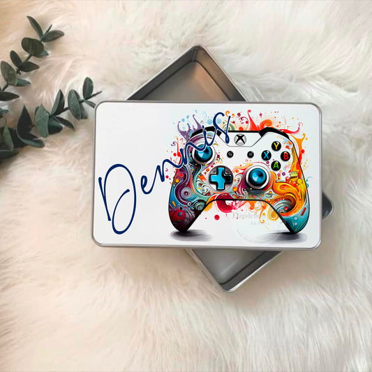 Printed with a gaming controller in vibrant colours and a name diagonally. Each tin measures  19.8cm x 12.8cm x 5cm. The lid lifts off and clicks back on. Gift for the gamers and legends