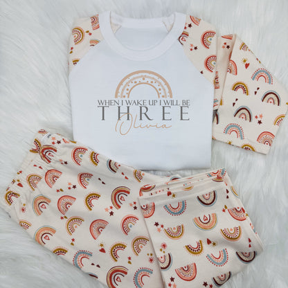 Get your little one ready to start their birthday in style with this adorable kids personalised outfit! 
Featuring a whimsical boho rainbow design on the front with 'When I wake up I will be (their age)' and their name too.
This bedtime outfit is both cute and comfy. 
Perfect to make your child feel special.

These are super soft, long sleeve top and bottom and 100% cotton.
Please take a look at the size guide in the photos before ordering.