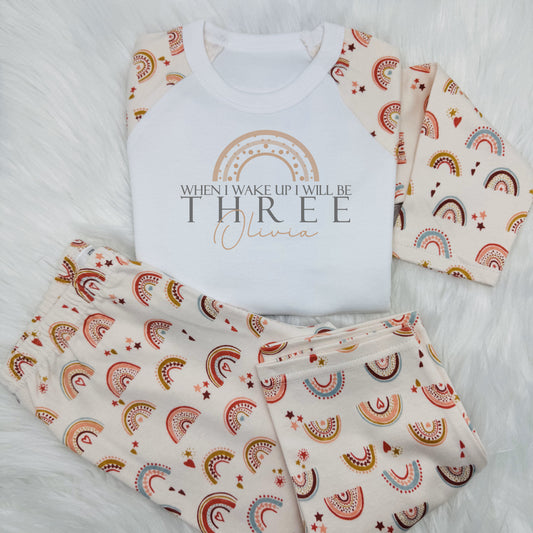 Get your little one ready to start their birthday in style with this adorable kids personalised outfit! 
Featuring a whimsical boho rainbow design on the front with 'When I wake up I will be (their age)' and their name too.
This bedtime outfit is both cute and comfy. 
Perfect to make your child feel special.

These are super soft, long sleeve top and bottom and 100% cotton.
Please take a look at the size guide in the photos before ordering.