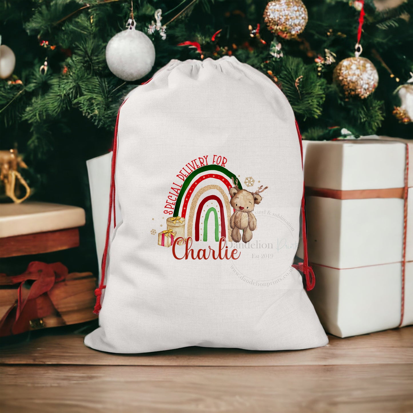 This is an extra large christmas Santa sack printed with a lovely little brown bear standing infront of a festive rainbow. Special delivery for is printed along the arc of the top of the rainbow with a name printed at the bottom.