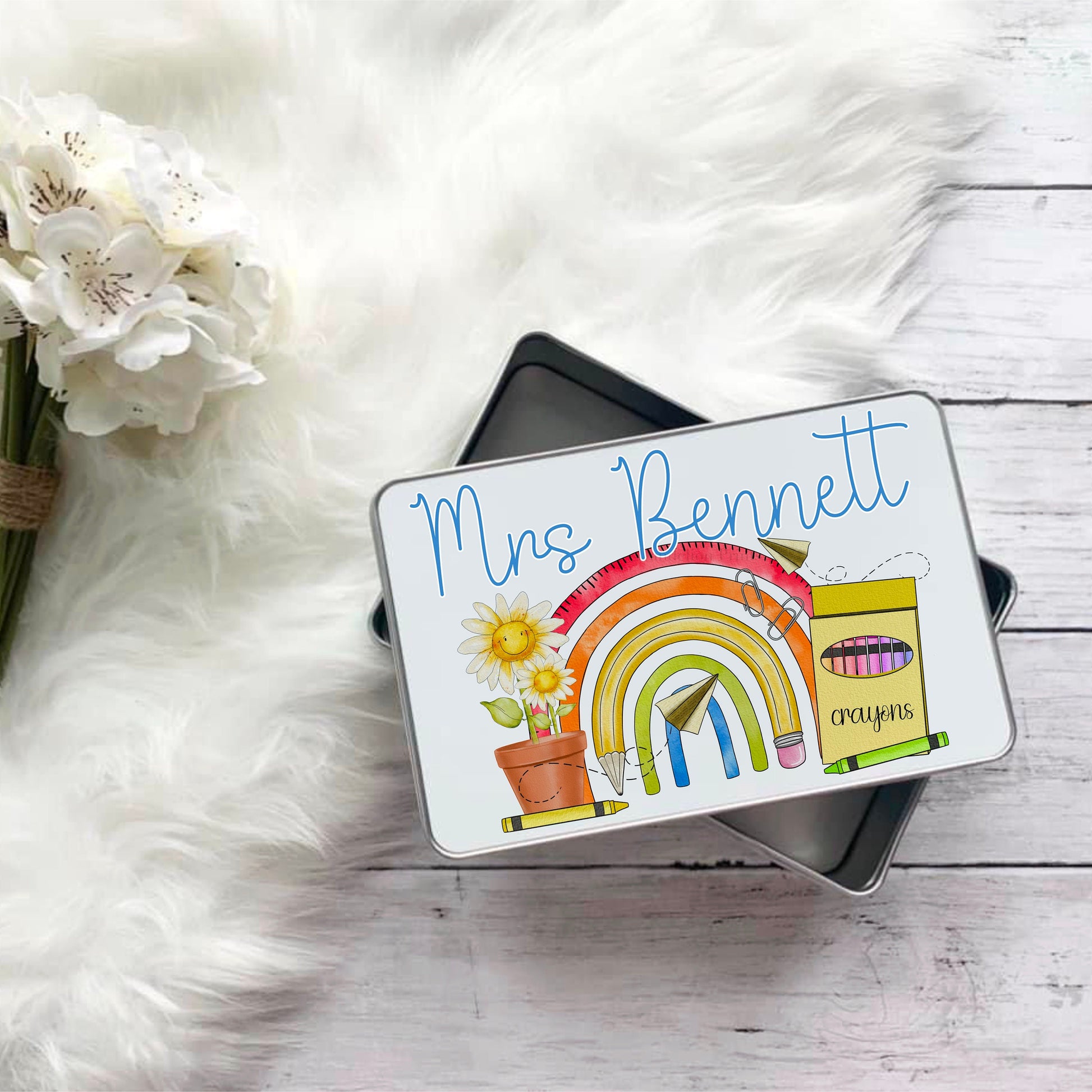 This is a tin with a teachers rainbow printed. Personalised with a teachers name this is a lovely gift for your favourite teacher