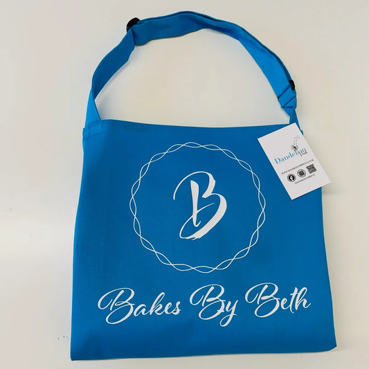 This is an adults apron branded with a company logo. We can embroider, print or vinyl print these aprons. They also come in many different colour options.
