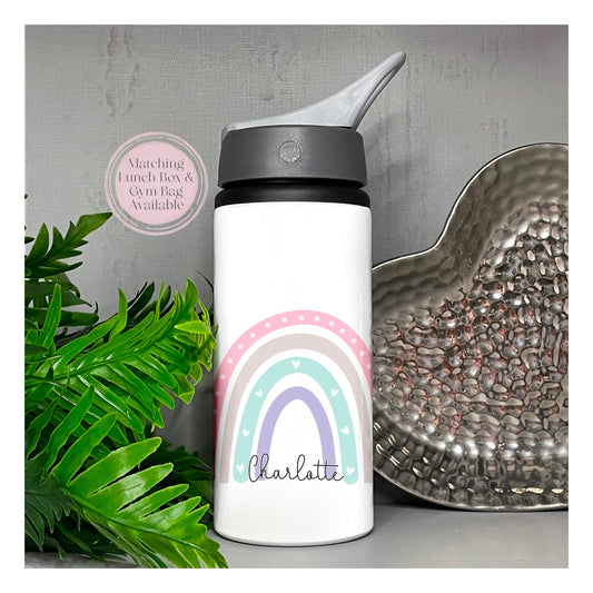 This is a 650ml aluminium flask with a flip straw lid. The flask has a carry handle on the top. This is printed with a lovely pastel rainbow with little hearts inside and a name along the bottom.