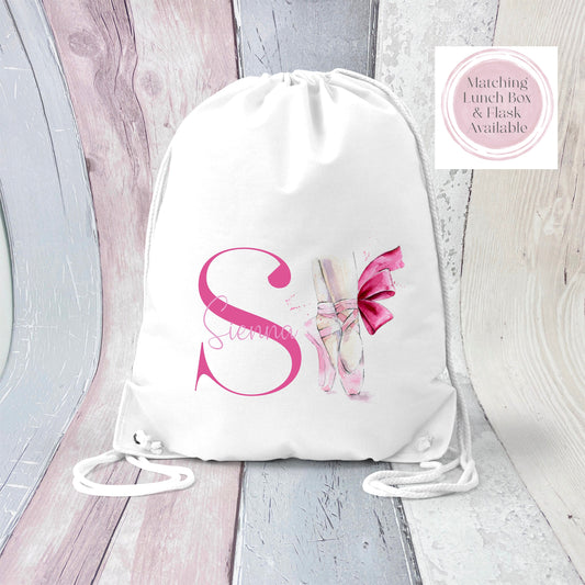Image of a white PE bag with white drawstrings and a printed image to the front.  The image is of an initial S with the name Sienna in pink and a pair of ballet shoes to the side.