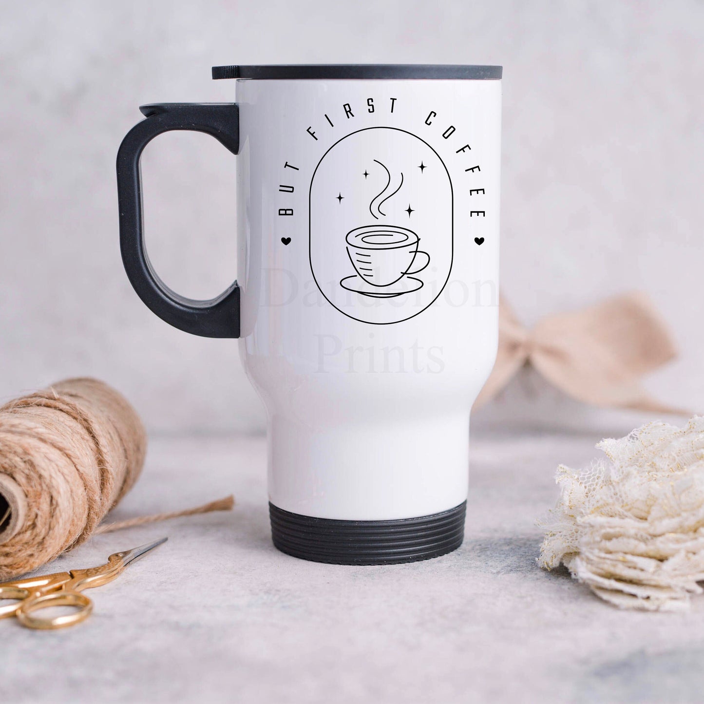 This is a 12oz travel mug with a turning lid to reveal a drinking spout. The mug is printed with a coffee cup and the words BUT FIRST COFFEE.