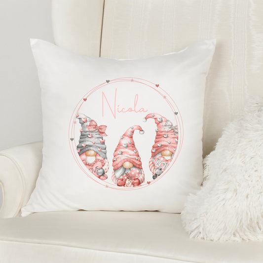 This is a 40x40cm soft white velvet cushion. Printed with three pink gonks in a love heart frame. Inside the frame is a name printed in the middle.