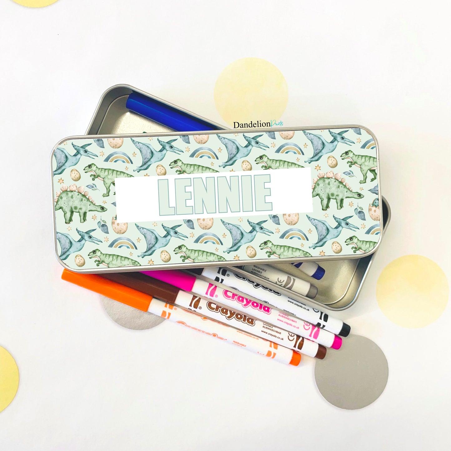 This is a metal pencil tin suitable for children. It is printed with a seamless pattern of dinosaurs and a name in the middle. Little ones will love storing their colouring pens and pencils in their tin