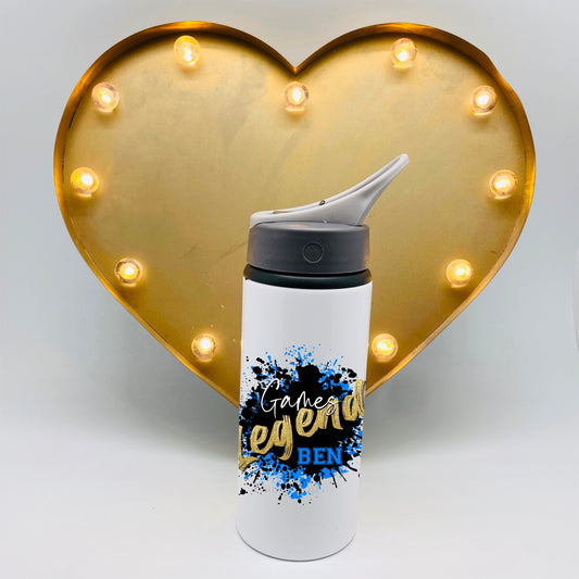 this is a Gaming legend flask suitable for use at school. The games legend design is in gold with black and gold ink spill background. The flask features a straw lid with a carry handle.