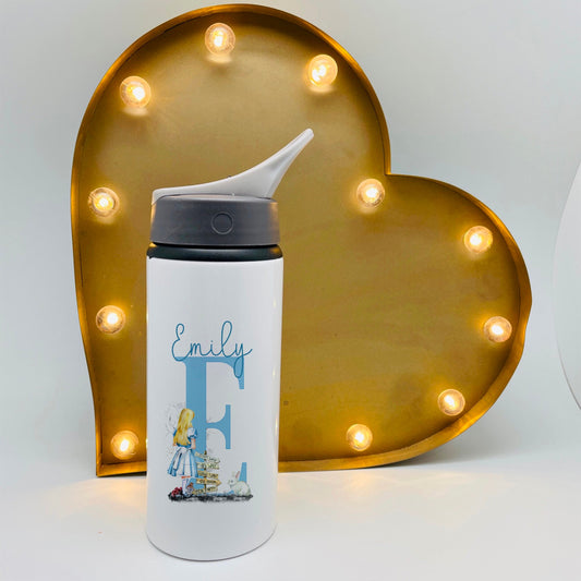 This is a beautiful Alice in wonderland inspired school or nursery flask. The features a carry handle with a flip straw opening. Personalised with a name at the top