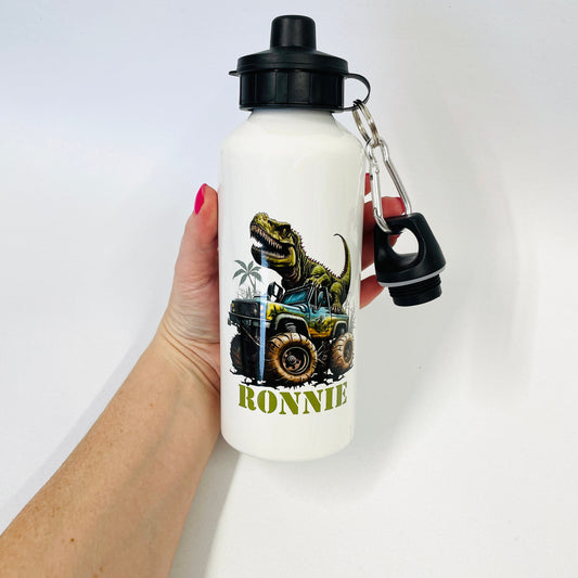 This a cool T-Rex design suitable for older children. The T-Rex is driving a safari truck. The print also has a name at the bottom. The flask is metal and features two lids, twist off and lift open.