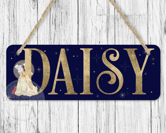 Pretty girls bedroom door sign featuring a princess in a gold ball gown with a red rose. These signs have a dark blue starry background. A full name is printed in a gold leaf effect font. Lovely gift idea for a child’s bedroom or playroom