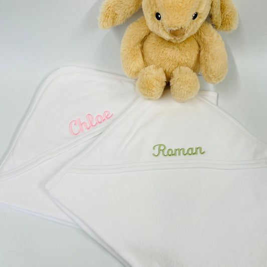 This is a lovely white, soft, hooded babies bath towel. The childs name is embroidered onto the hood in pink or sage. This is a lovely new baby or baby shower gift